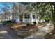 A lovely blue home sits on a landscaped corner lot, with a charming front porch at 101 S Bloodworth St, Raleigh, NC 27601