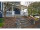 Cozy porch view showcases classic architecture with inviting seating and stone steps at 101 S Bloodworth St, Raleigh, NC 27601