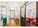 Hallway leading to a bright living space, with views of a creative room and abundant natural light at 101 S Bloodworth St, Raleigh, NC 27601