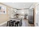 Well lit kitchen with granite counters, stainless steel appliances, and a kitchen island at 101 S Bloodworth St, Raleigh, NC 27601