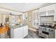 Spacious kitchen with granite counters, stainless steel appliances, and bright white cabinetry at 101 S Bloodworth St, Raleigh, NC 27601