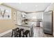 Modern kitchen with granite countertops, stainless steel appliances, and an island at 101 S Bloodworth St, Raleigh, NC 27601