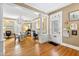 An open floor plan with hardwood floors with white accents and elegant columns at 101 S Bloodworth St, Raleigh, NC 27601