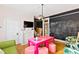 Inviting living room featuring a chalkboard wall and views of a connected creative work space at 101 S Bloodworth St, Raleigh, NC 27601