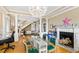 Stylish living space showcasing a glass table, fireplace, and staircase, perfect for modern living and entertaining at 101 S Bloodworth St, Raleigh, NC 27601