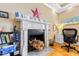 Cozy office space with a decorative fireplace, built-in shelving, and a comfortable workspace for productivity at 101 S Bloodworth St, Raleigh, NC 27601