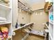 Walk-in closet with shelves and hanging rods at 101 S Bloodworth St, Raleigh, NC 27601
