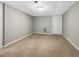 Unfinished basement featuring carpeted floor, bright walls, and door at 106 Woodland Dr, Cary, NC 27513