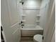 Clean bathroom with shower and tub combination features modern fixtures at 107 Willow Cameron Way, Angier, NC 27501