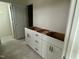 Bathroom area featuring white cabinets and sleek hardware, ready for personalized touch at 107 Willow Cameron Way, Angier, NC 27501