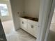 Bathroom area featuring modern, white cabinets ready for custom countertop and sink at 107 Willow Cameron Way, Angier, NC 27501