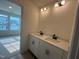 Bright bathroom features double sink vanity with modern fixtures and great natural light at 107 Willow Cameron Way, Angier, NC 27501