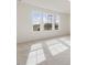 Bedroom has carpet, light-colored walls and three windows at 107 Willow Cameron Way, Angier, NC 27501