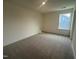 Neutral bedroom with carpet flooring features a window letting in natural light at 107 Willow Cameron Way, Angier, NC 27501