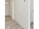 The entryway features light walls and wood-look floors with an outside door at 107 Willow Cameron Way, Angier, NC 27501