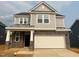 Charming two-story home with stone accents and a two-car garage at 107 Willow Cameron Way, Angier, NC 27501
