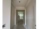 Hallway showing entry into another room that is lined with windows at 107 Willow Cameron Way, Angier, NC 27501