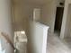 Staircase landing hallway features white trim and natural light that flow throughout space at 107 Willow Cameron Way, Angier, NC 27501