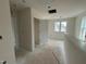Hallway with doors leading to bedrooms or living areas, illuminated by natural light at 107 Willow Cameron Way, Angier, NC 27501