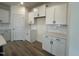 Clean kitchen design with white cabinets, countertops, and stainless steel appliances at 107 Willow Cameron Way, Angier, NC 27501