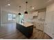 Open-concept kitchen with a center island, perfect for entertaining at 107 Willow Cameron Way, Angier, NC 27501