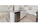 Kitchen island with stainless steel dishwasher and gray granite countertop at 107 Willow Cameron Way, Angier, NC 27501