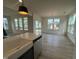 Open-concept kitchen featuring stainless steel appliances and large windows at 107 Willow Cameron Way, Angier, NC 27501