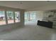 Open-concept with a kitchen and living room with multiple windows for natural light at 107 Willow Cameron Way, Angier, NC 27501