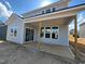 New construction home features covered patio with sliding glass door access at 107 Willow Cameron Way, Angier, NC 27501