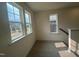 Upstairs carpeted landing with natural light at 107 Willow Cameron Way, Angier, NC 27501