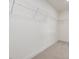 The walk-in closet features carpet and white walls with metal shelving at 107 Willow Cameron Way, Angier, NC 27501
