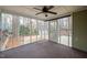 Enclosed porch with fan, screen and access to the backyard and shed at 108 Boxford Rd, Morrisville, NC 27560