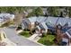 Aerial view of a neighborhood's neatly landscaped townhomes on a sunny day at 11213 Presidio Dr, Raleigh, NC 27617