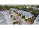 An aerial view of a neighborhood with townhomes nestled among green trees at 11213 Presidio Dr, Raleigh, NC 27617