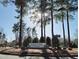 Brier Creek Country Club entrance featuring lush landscaping and mature trees at 11213 Presidio Dr, Raleigh, NC 27617