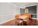 Modern dining area with hardwood floors, contemporary lighting, and stylish decor at 11213 Presidio Dr, Raleigh, NC 27617