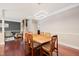 Dining room featuring hardwood floors, modern chandelier and gray accent wall at 11213 Presidio Dr, Raleigh, NC 27617
