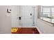 Bright entryway featuring hardwood floors, white door and a granite countertop at 11213 Presidio Dr, Raleigh, NC 27617