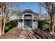 White gazebo is surrounded by a hedge with homes in the background at 11213 Presidio Dr, Raleigh, NC 27617