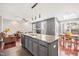 Kitchen island with gray cabinets and a granite countertop, and stainless steel sink at 11213 Presidio Dr, Raleigh, NC 27617