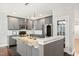 Kitchen featuring granite countertop, stainless steel appliances, sink and gray cabinets at 11213 Presidio Dr, Raleigh, NC 27617