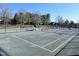 View of multiple tennis courts with a covered rest area at 11213 Presidio Dr, Raleigh, NC 27617