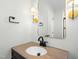 Bathroom with sleek black fixtures, a warm countertop, and contemporary lighting at 11705 Appaloosa E, Raleigh, NC 27613