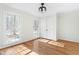 Sun-filled bedroom boasting hardwood floors, double windows, and a closet with double doors at 11705 Appaloosa E, Raleigh, NC 27613