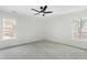 Bright bedroom with soft carpet, ceiling fan, and two windows that bring in lots of light at 11705 Appaloosa E, Raleigh, NC 27613