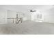 Large bonus room with neutral carpet, a ceiling fan, and lots of natural light at 11705 Appaloosa E, Raleigh, NC 27613