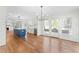Kitchen features stainless steel appliances, an island, an open floor plan, and hardwood floors at 11705 Appaloosa E, Raleigh, NC 27613