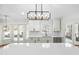 A chef's kitchen features stainless steel appliances, white cabinets and a window view at 11705 Appaloosa E, Raleigh, NC 27613