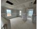 Open living area with large windows and unfinished drywall, awaiting customization at 135 Cameron Willow Way Way, Angier, NC 27501