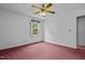 Empty bedroom with red carpet and a ceiling fan at 135 Rainbow Dr, Dunn, NC 28334